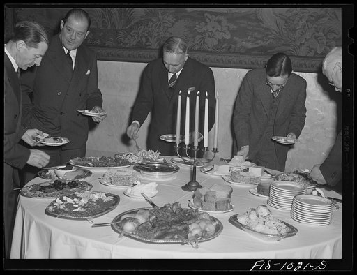 Minneapolis, Minnesota. Before the meeting of the Swedish Club opens, everyone partakes of the smorgasbord