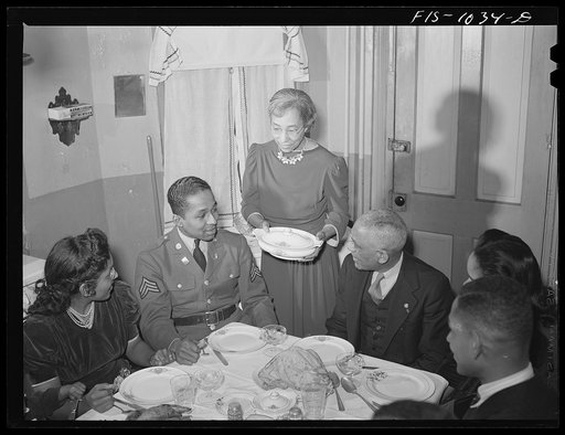 Untitled photo, possibly related to: Baltimore, Maryland. Sargeant Franklin Williams, home on leave from Army duty, with his father and mother