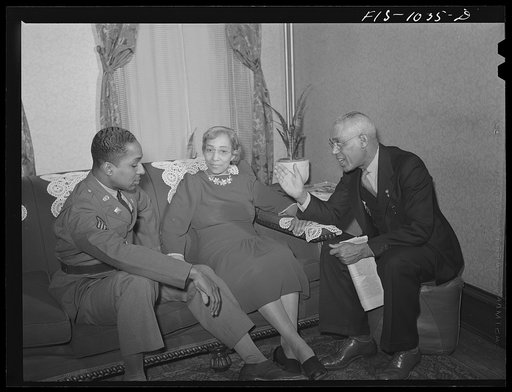 Untitled photo, possibly related to: Baltimore, Maryland. Sargeant Franklin Williams, home on leave from Army duty, with his father and mother
