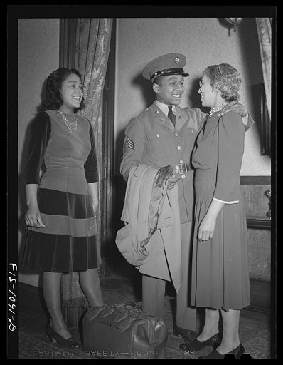 Baltimore, Maryland. Sargeant Franklin Williams, home on leave from Army duty, saying goodbye to his mother before leaving for Fort Bragg