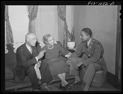 Baltimore, Maryland. Sargeant Franklin Williams, home on leave from Army duty, with his father and mother