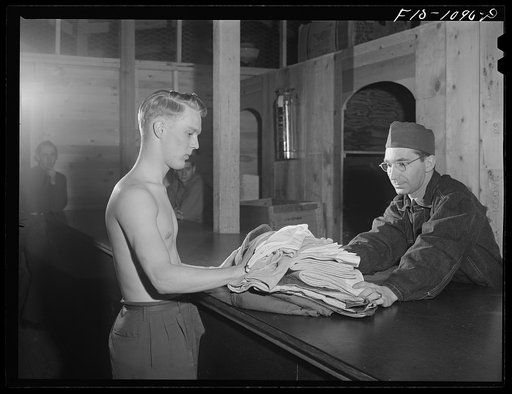 Swedish-American selectee of Minnesota receiving issue of clothing as he is inducted into the U.S. Army