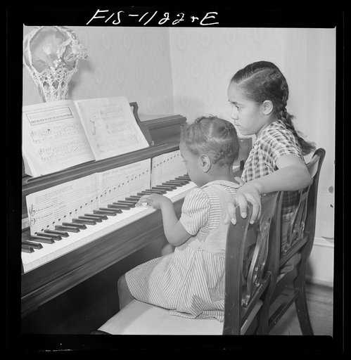 Washington, D.C. All the family of Jewal Mazique [i.e. Jewel], worker at the Library of Congress, takes music lessons