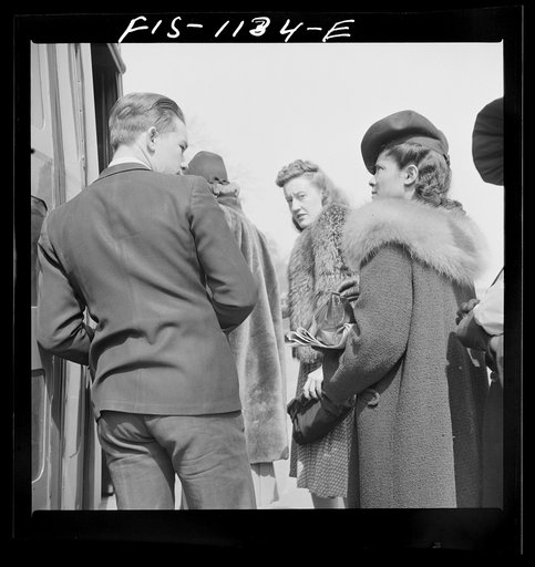 Untitled photo, possibly related to: Washington, D.C. Jewal Mazique [i.e. Jewel], worker at the Library of Congress, going home