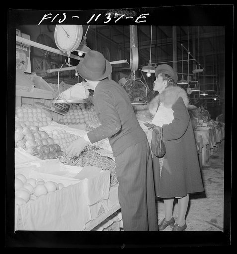 Untitled photo, possibly related to: Washington, D.C. Jewal Mazique [i.e. Jewel] doing her shopping enroute home from her job in the Library of Congress