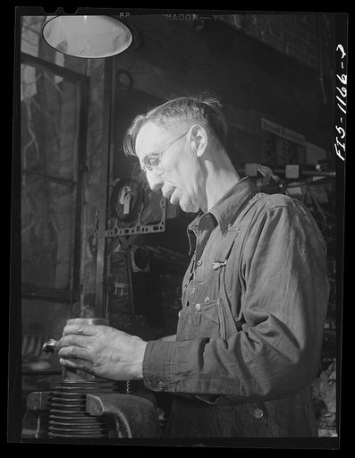 A defense worker who was born in Sweden, welding at a plant in Minnesota, possibly the Northern Pump Company in Minneapolis