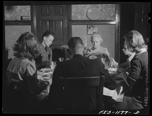Minneapolis, Minnesota. The Lindstrom family with a soldier of Swedish extraction who has been invited for Sunday dinner