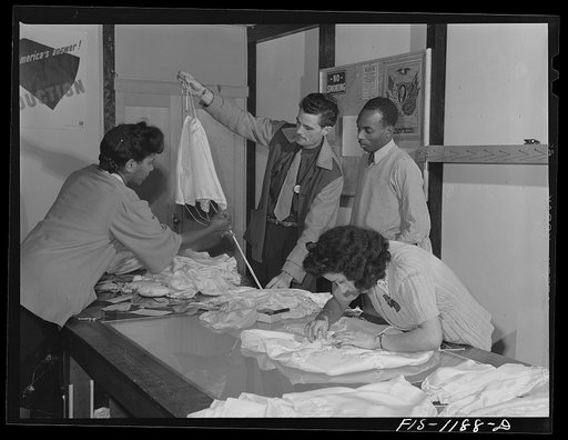 Final inspection of pilot parachutes at the Pacific Parachute Company. San Diego, California
