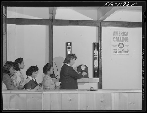Employees of the Pacific Parachute Company, checking in for work. San Diego, California