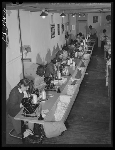 Line of sewing machines on which most of the work on the pilot parachutes is done. Pacific Parachute Company. San Diego, California