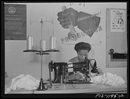 Hemming a pilot parachute on a double needle sewing machine at the Pacific Parachute Company. San Diego, California