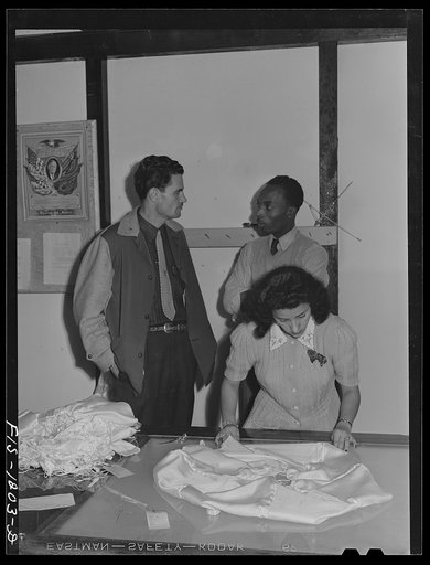 San Diego, California, Pacific Parachute Company. Inspector of the Standard Parachute Company and "Skippy" Smith, manager of the Pacific Parachute (subcontractor of Standard Parachute), at the final inspection of pilot parachutes