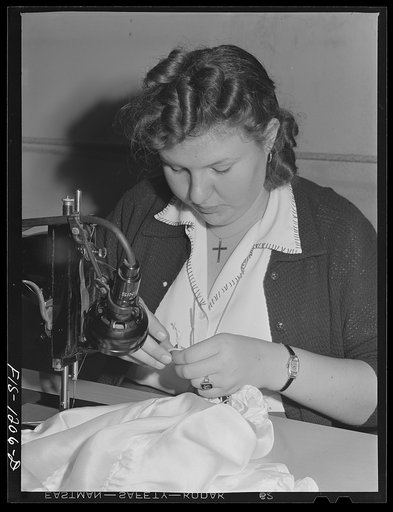 Employee tying the knots for the shrouds on a pilot parachute. Pacific Parachute Company. San Diego, California