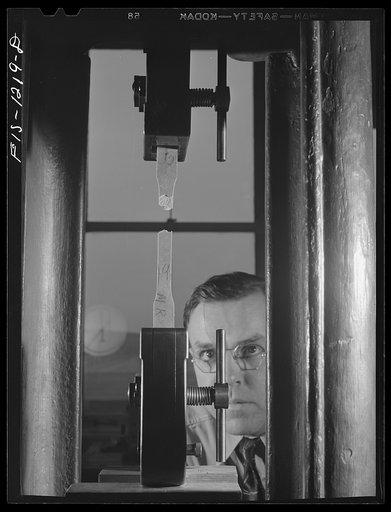 Forest Products Laboratory, Madison, Wisconsin. Testing the tensile strength of impregnated paper board in the timber mechanics department