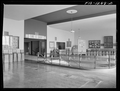 Forest Products Laboratory, Madison, Wisconsin. The entrance hall and reception room. The floors and railings are made of wood, and along the walls are exhibits of the work being done in the laboratory