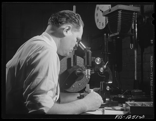 Forest Products Laboratory, Madison, Wissonsin. Dr. R.O. Marts in his laboratory. He is using an Ultropak microscope for the detection of obscure defects in airplane veneer
