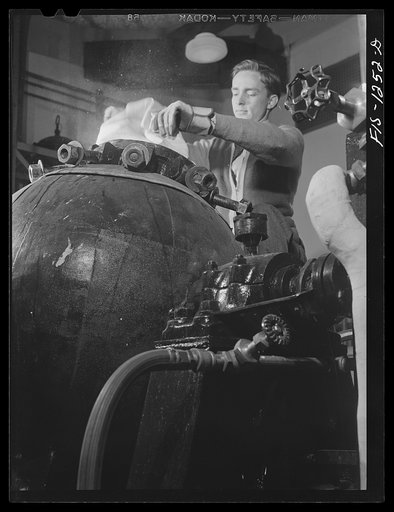 Untitled photo, possibly related to: Forest Products Laboratory, Madison, Wisconsin. The Forest Products Laboratory has developed from lignin a black plastic which looks like bakelite. Wood contains about eighty percent cellulose fibre and twenty percent lignin, which has heretofore been considered 