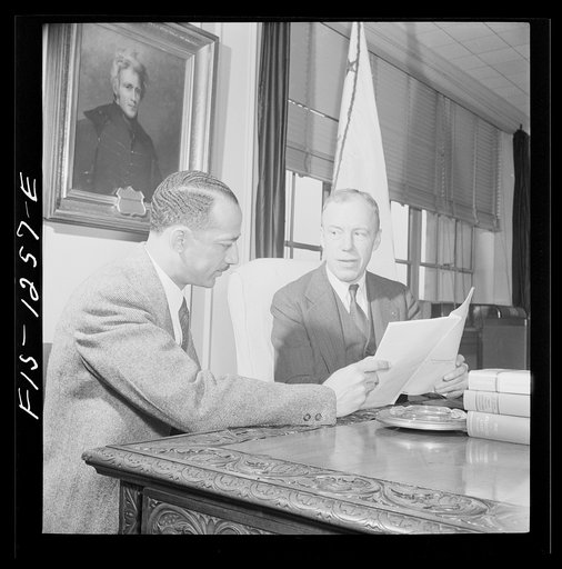 Untitled photo, possibly related to: Washington, D.C. William H. Hastie, civilian aide to the Secretary of War, in conference with Undersecretary of War Patterson