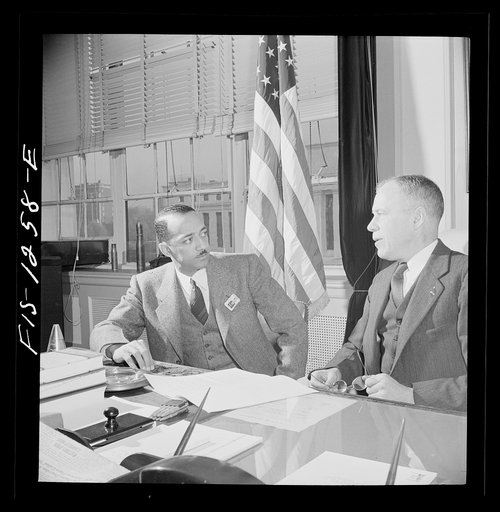 Washington, D.C. William H. Hastie, civilian aide to the Secretary of War, in conference with Undersecretary of War Patterson