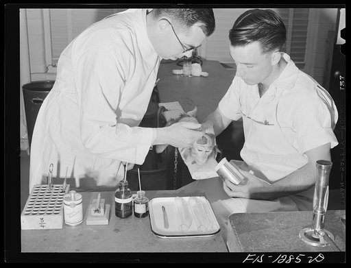 Testing yellow fever serum by injecting it into the brain of a monkey. USPHS (United States Public Health Service)  Rocky Mountain Laboratory, Hamilton, Montana