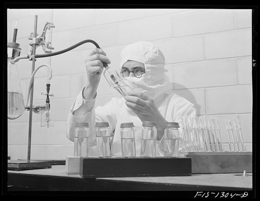 Dispensing yellow fever vaccine into ampules. USPHS (United States Public Health Service)  Rocky Mountain Laboratory. Hamilton, Montana