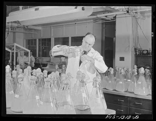 Doctor Herrald R. Cox with flasks of the typhus vaccine obtained from eggs according to the method which he developed. USPHS (United States Public Health Service)  Rocky Mountain Laboratory. Hamilton, Montana