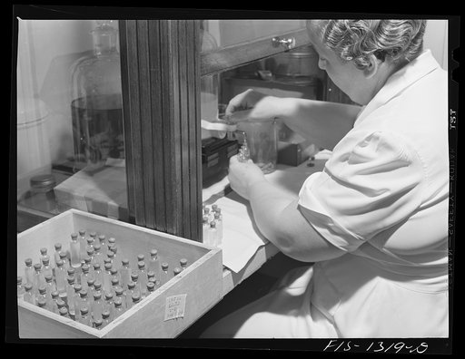 Bottling eight cubic centimeter quantities of typhus vaccine. USPHS (United States Public Health Service)  Rocky Mountain Laboratory. Hamilton, Montana