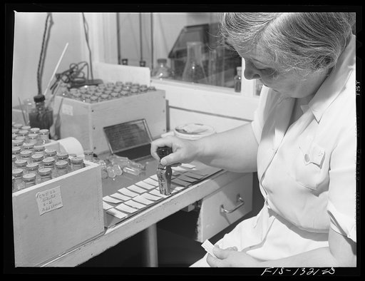 Preparing labels for bottled vaccines. USPHS (United States Public Health Service)  Rocky Mountain Laboratory. Hamilton, Montana