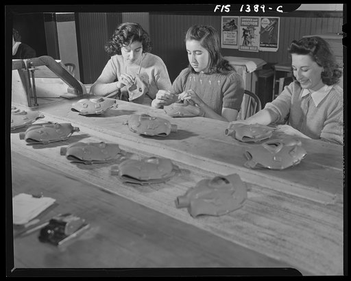 Untitled photo, possibly related to: New Bedford, Massachusetts. Portuguese girls manufacturing gas masks