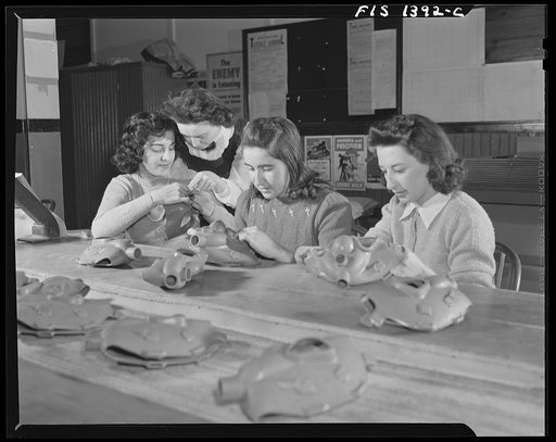Untitled photo, possibly related to: New Bedford, Massachusetts. Portuguese girls manufacturing gas masks