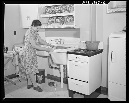 Untitled photo, possibly related to: New Bedford, Massachuetts. Wife of Portuguese house painter in her home built by the government