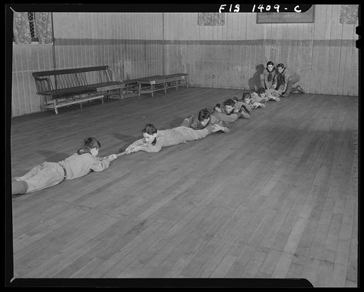 Untitled photo, possibly related to: New Bedford, Massachusetts. Portuguese scout troop performing stunt