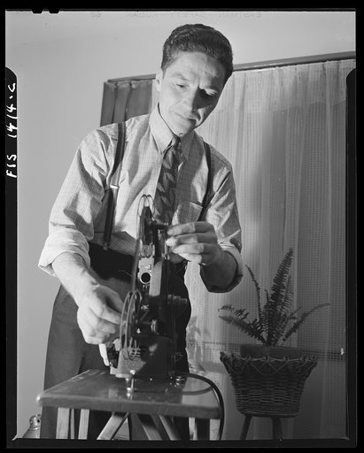 New Bedford, Massachusetts. Amateur movies is the hobby of this Portuguese workman