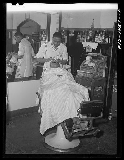 Mr. Oscar J. Freeman, barber, owns the Metropolitan Barber Shop, 4654 South Parkway, Chicago, Illinois. He has been in business fourteen years