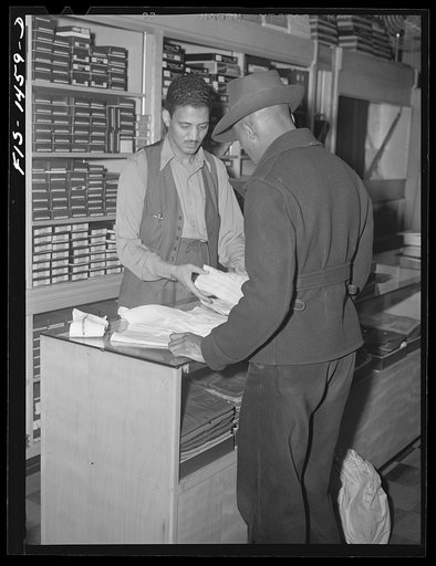Mr. William Strong (left), manager of the Henry C. Taylor Store for Men, selling underclothes to Mr. J. Foster. 47th Street near State Street, Chicago, Illinois