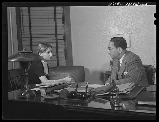Untitled photo, possibly related to: Mr. Albert W. Williams, president of the Unity Life Insurance Company, dictating to secretary DeAcklin. Mr. Williams was born in Georgia, studied at the University of Pennsylvania, worked for eight years for an insurance company in Washington, D.C. then went to N