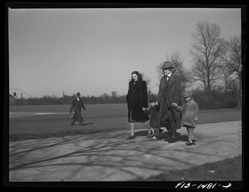 Mr. and Mrs. "Red" Sounders [i.e. Saunders] and the children go for a walk in the park on a brisk April Sunday afternoon. Chicago, Illinois
