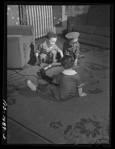 Chicago, Illinois. "Red" Sounders' [i.e. Saunders] children playing with a neighbor's little boy (in soldier's uniform) whose name is Martin Brown
