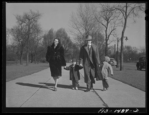Mr. and Mrs. "Red" Sounders [i.e. Saunders] and the children go for a walk in the park on a brisk April Sunday afternoon. Chicago, Illinois