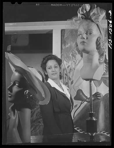 Untitled photo, possibly related to: Miss Selma Barbour, manager of the Cecilian Specialty Hat Shop, 454 East 47th Street. Miss Barbour has been managing this store for one year, and has been in business for four years. She was born in New Orleans, and has eight brothers, seven of whom are eligible 