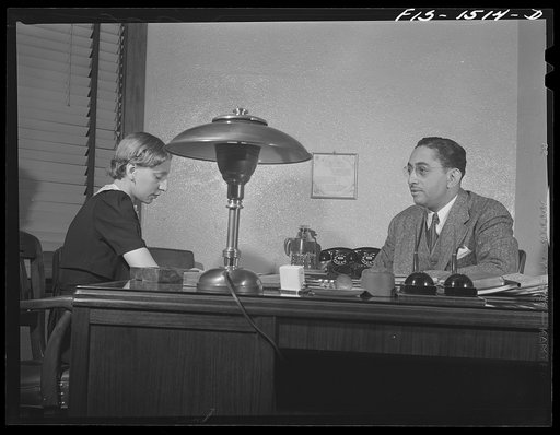 Mr. Albert W. Williams, president of the Unity Life Insurance Company, dictating to secretary DeAcklin. Mr. Williams was born in Georgia, studied at the University of Pennsylvania, worked for eight years for an insurance company in Washington, D.C. then went to New Orleans, and for the last fifteen 