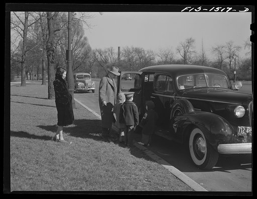 Untitled photo, possibly related to: An uncle of "Red" Sounders [i.e. Saunders] stops by to take the children for a ride in the park. Chicago, Illinois