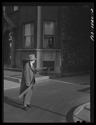 On his way to play at an afternoon show "Red" Sounders [i.e. Saunders] stops to say goodbye to his wife. Chicago, Illinois