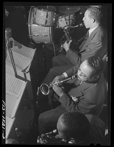 Untitled photo, possibly related to: "Red" Sounders [i.e. Saunders], drummer, and his band at the Club DeLisa, Chicago, Illinois