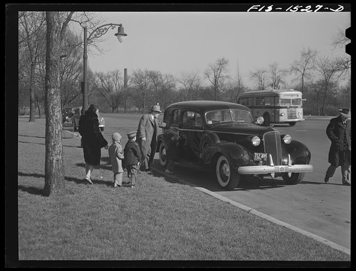 An uncle of "Red" Sounders [i.e. Saunders] stops by to take the children for a ride in the park. Chicago, Illinois