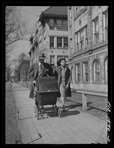 Untitled photo, possibly related to: Mr. and Mrs. Oliver Coleman taking their five-month-old son out for some air along Indiana Avenue. Chicago, Illinois