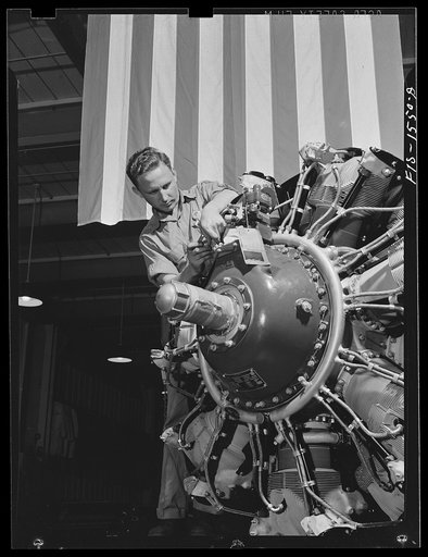 North American Aviation, Incorporated. Inglewood, California(?). A Wright whirlwind engine for a B-25 bomber receiving a final checkup before moving to the final assembly floor