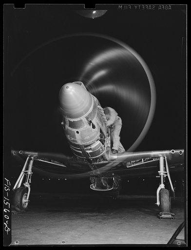 North American aviation, inc., Inglewood, Calif(?). 1942(?). A mechanic testing the power of a R-51 "Mustang" fighter plane