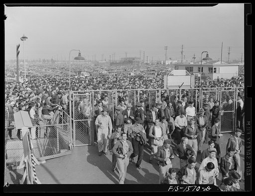 North American Aviation, Incorporated, Inglewood, California. Thousands of skilled craftsmen all over America enter the gates of warplane factories each day. Employees must display their badges and identification cards before admittance