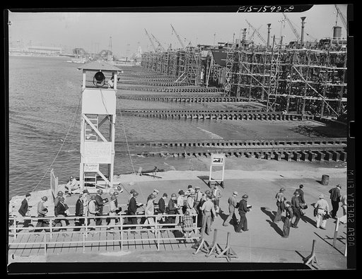 California Shipbuilding Corporation, Wilmington, California. Workmen coming ashore from a ferry